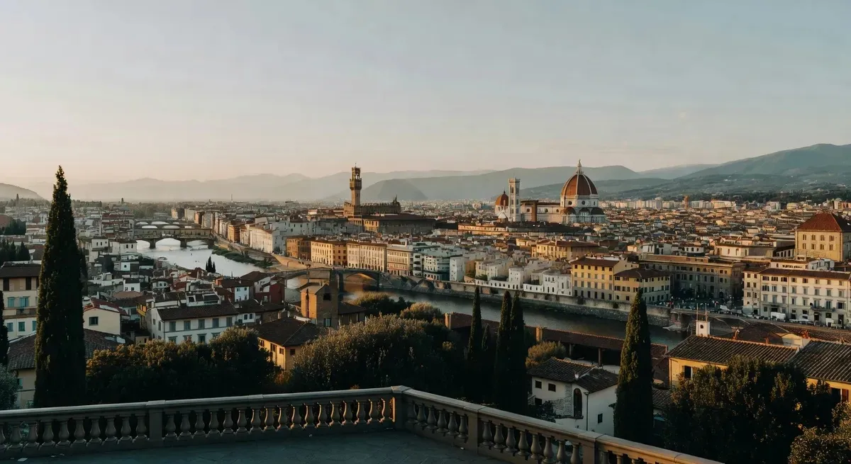 Panoramic view from Piazzale Michelangelo over Florence at golden hour — Brunelleschi's Dome, Palazzo Vecchio tower and the Arno River bridges visible on a golf cart tour Florence