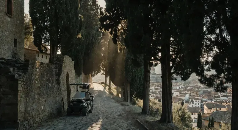 Golf cart tour Florence Galileo route through Arcetri olive groves and hilltop observatory above the Tuscan skyline